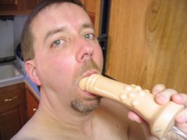 Kevin Lieby practicing cock sucking with dildo